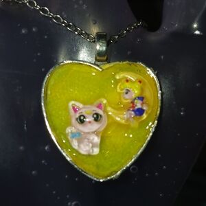 Heart-Shaped Pendant with Cat and Character